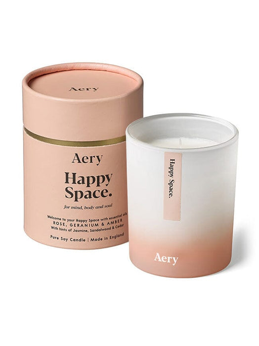 Pink Happy Space Candle by Aery displayed next to product packaging on white background 