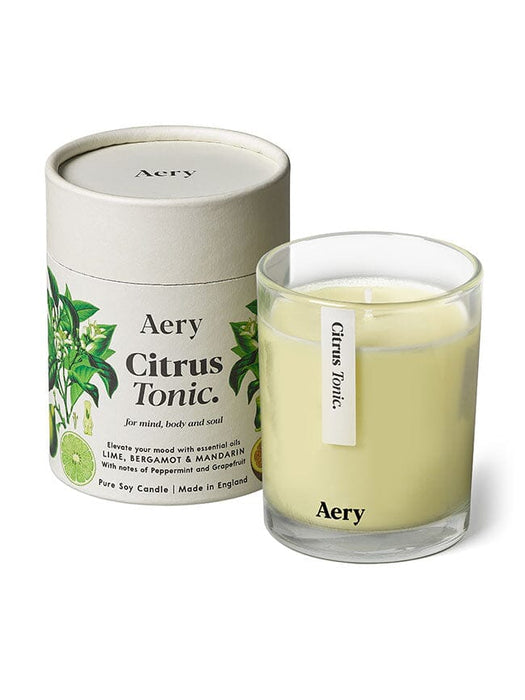 Cream Citrus Tonic candle by Aery displayed next to product packaging on white background 