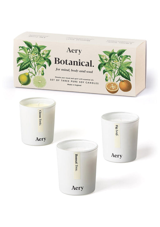 Cream Botanical gift set of three mini votive candles by Aery displayed next to Product packaging on white background 