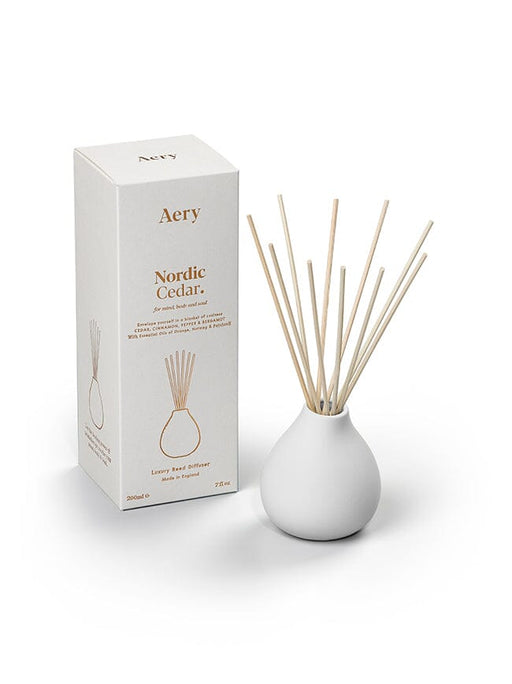 White Nordic Cedar diffuser by Aery displayed next to product packaging on white background 