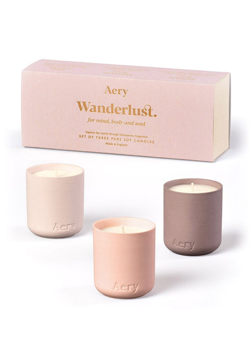 Pink Wanderlust gift set of three mini votive candles by Aery displayed by product packaging on white bacground 