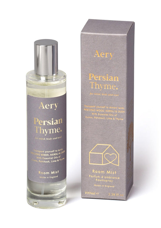 Grey Persian Thyme room mist by aery displayed next to product packaging on white background 