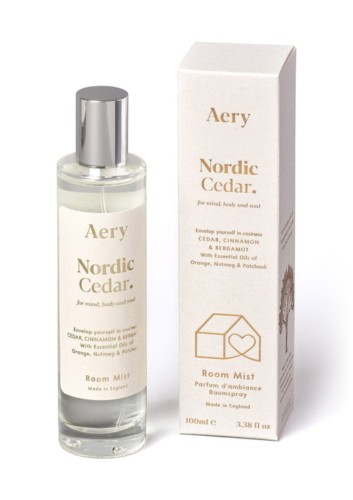 White Nordic Cedar room mist by Aery displayed next to product packaging on white background 