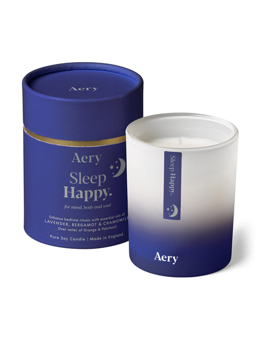 Blue Sleep Happy candle by Aery displayed next to product packaging on white bacground 