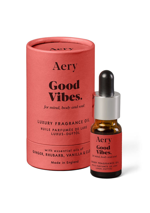 Red Good Vibes fragrance oil by Aery displayed next to product packaging on white background 