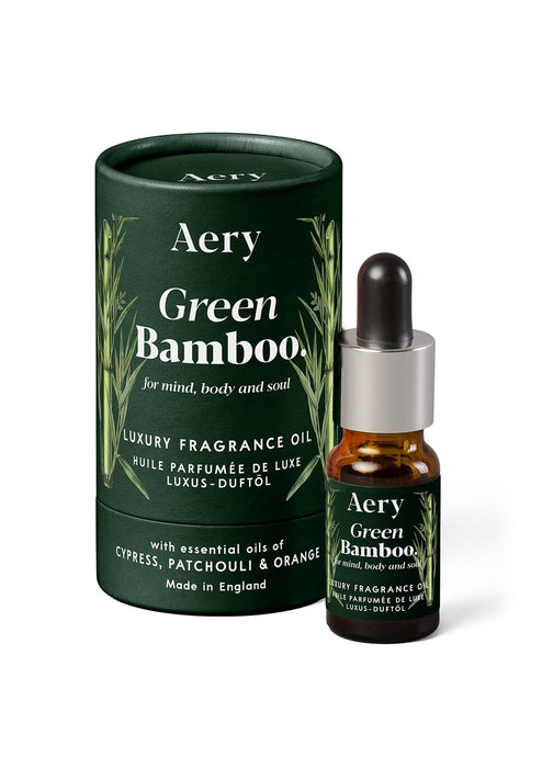 Green Bamboo Fragrance Oil by Aery displayed next to product packaging on white bacground 