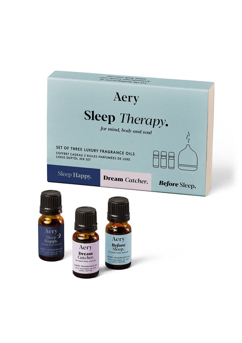 Blue Sleep Therapy set of three fragrance oil by Aery displayed next to product packaging on white bacground 