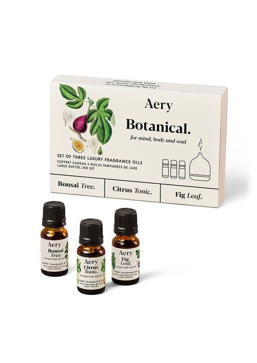 Cream Botanical set of three fragrance oils by Aery displayed next to product packaging on white background 