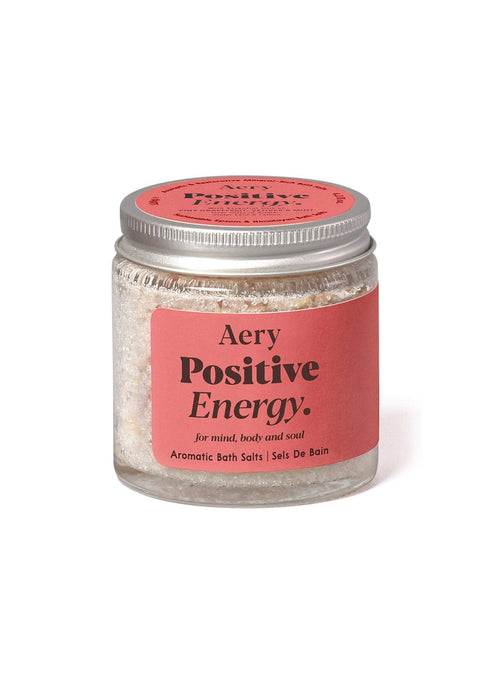 Red Positive Energy bath salts on white background 