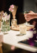 Tomato Leaf candle by Aery displayed on kitchen work surface with flowers