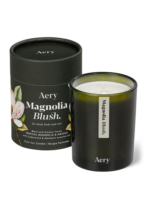 Magnolia Blush candle by Aery displayed next to product packaging on white background 