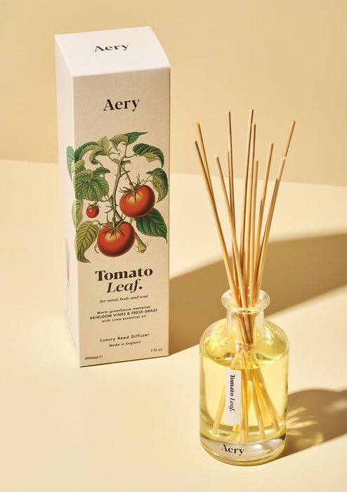 Tomato Leaf diffuser by Aery displayed next to product packaging on yellow background 