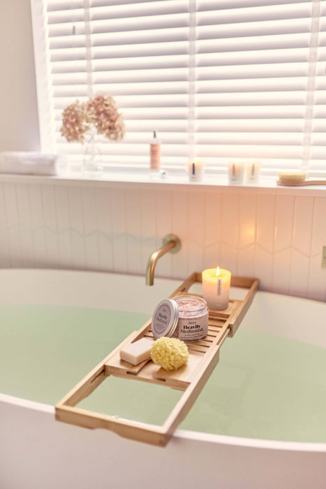 Beige Heavily Meditated bath salts by aery displayed on wodden bath tray in bathroom 