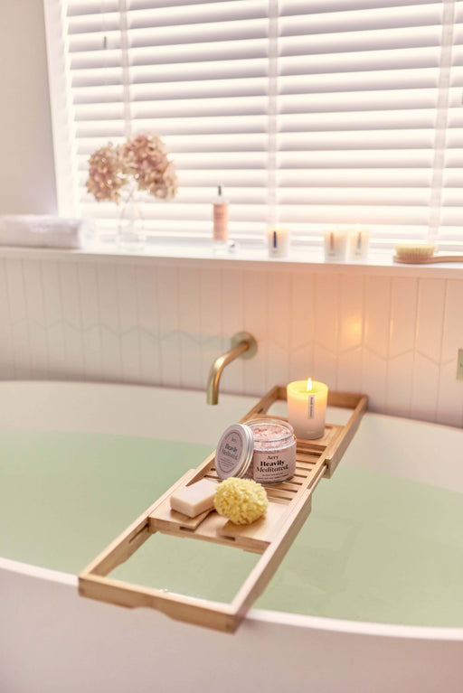 Beige Heavily Meditated bath salts by aery displayed on wodden bath tray in bathroom 