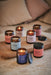 collection of aromatherapy jar candles by aery displayed on wooden tray