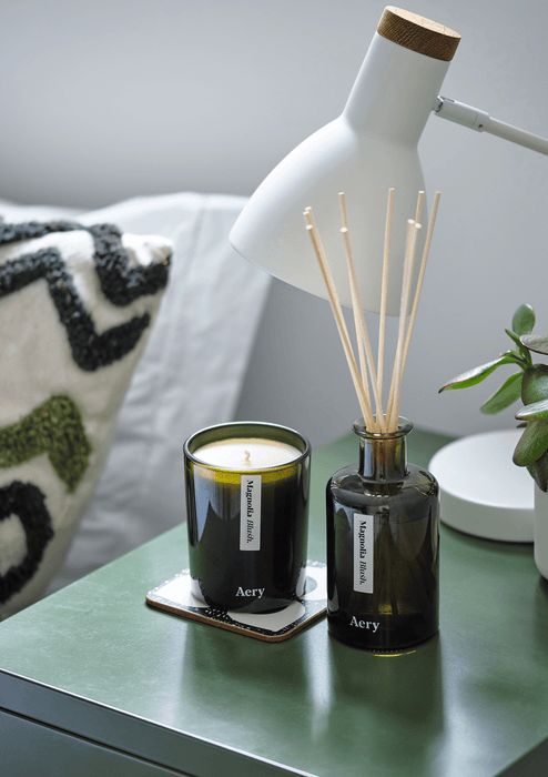 Magnolia Blush Diffuser and candle on bedside table 