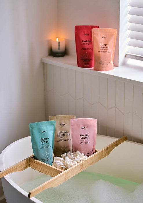 collection of bath salt refill bags displayed in bathroom setting