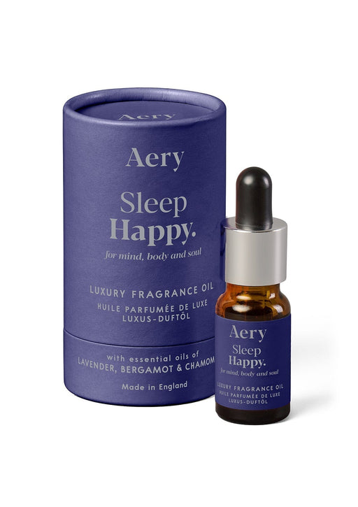 sleep happy fragrance oil displayed next to decorative packaging